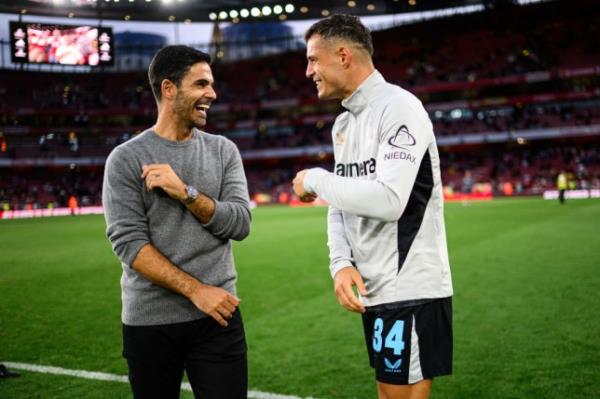 Mikel Arteta of Arsenal and Granit Xhaka of Leverkusen after the pre-season friendly match between Arsenal and Bayer 04 Leverkusen at Emirates Stadium 