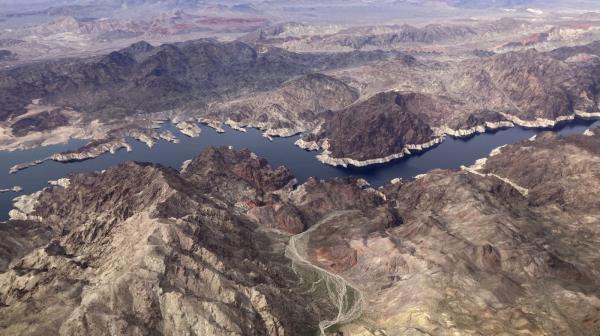FILE - A bathtub ring shows where the water mark on Lake Mead once was along the boarder of Nevada and Arizona, March 6, 2023, near Boulder City, Nev. Nearly half of the U.S. West has emerged from drought, but intense water challenges persist, scientists said Tuesday, May 9. (AP Photo/John Locher, File)