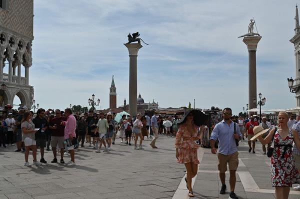 Venetians plead ‘please don’t come’ as tourists jam city