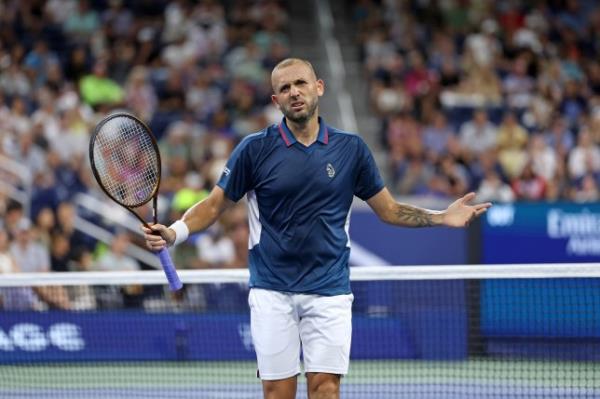 Britain's Daniel Evans reacts after a point against Australia's Alex de Minaur