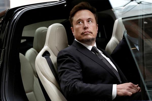 Elon Musk in a Tesla