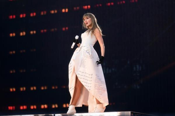 Taylor Swift performing onstage in a custom Vivienne Westwood ensemble during 'The Eras Tour' in Zurich, Switzerland on July 9, 2024