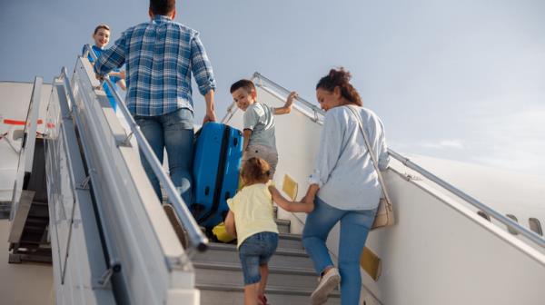 Family boarding airplane
