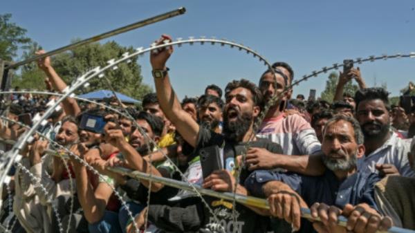 Kashmiris attend an election rally held by Sheikh Abdul Rashid also known as &quot;Engineer&quot; Rashid, a member of parliament in Baramulla on 12 September. Photo: TAUSEEF MUSTAFA / AFP