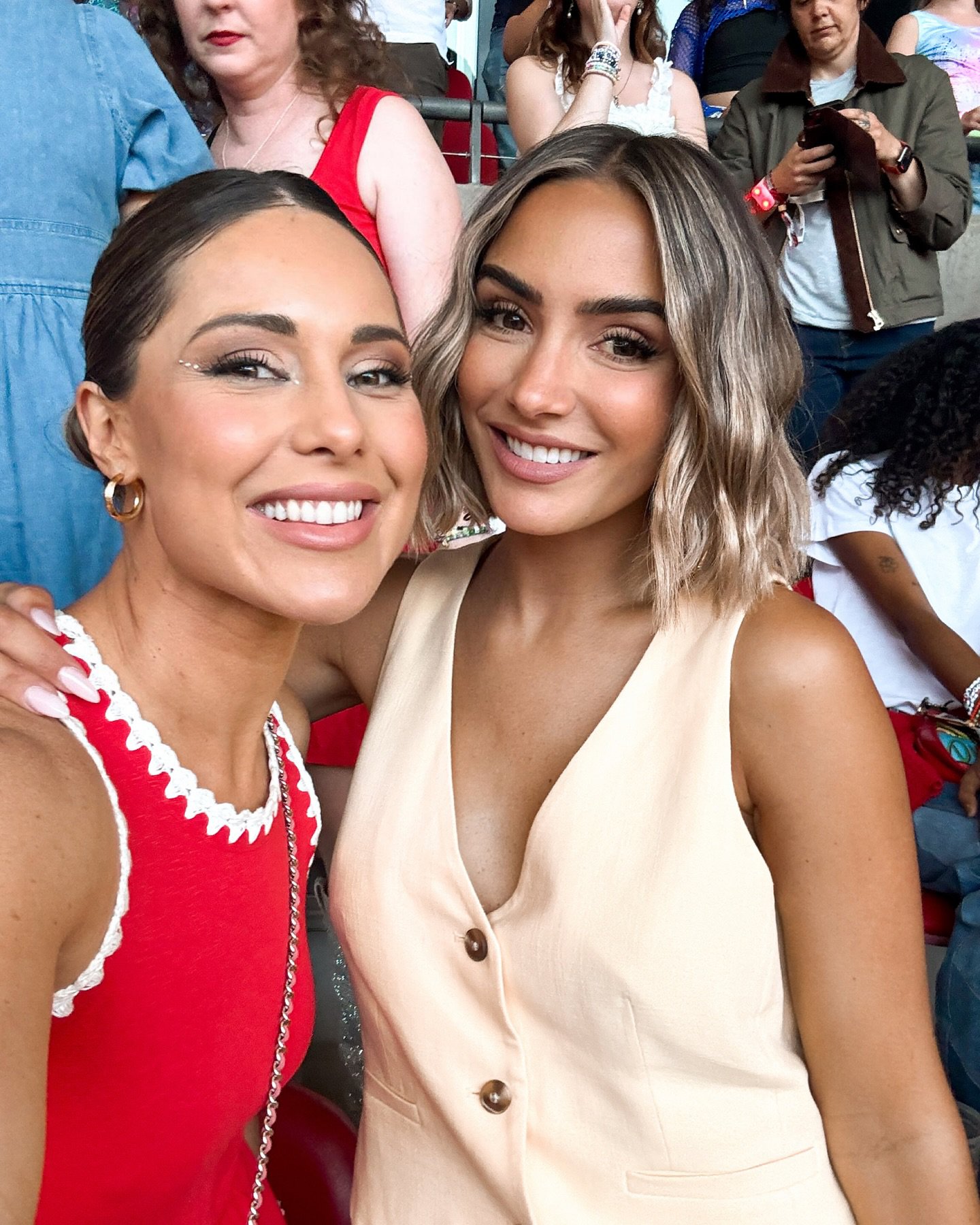 Louise Thompson and Frankie Bridge posing together at a Taylor Swift concert