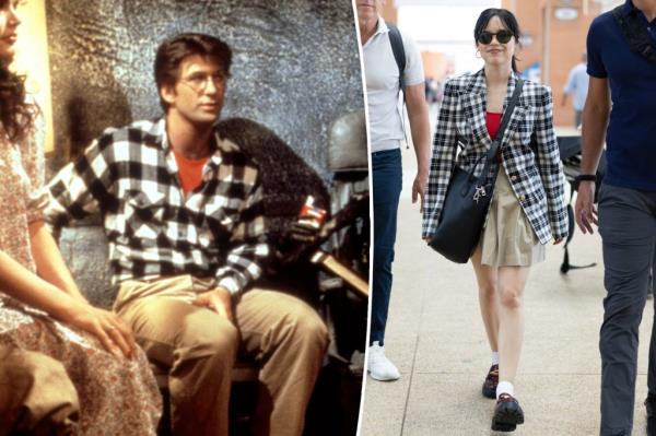 Ortega in a black and white plaid blazer over a red top paired with a pleated khaki Sans Faff mini skirt