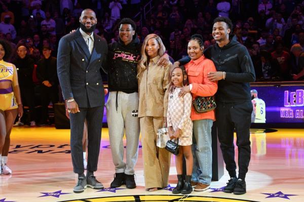 (L-R) LeBron James, Bryce James, Savannah James, Zhuri James, Gloria Marie James, and Bronny James attend a ceremony honoring LeBron James' historic achievement of becoming NBA's all-time leading scorer prior to a basketball game between the Los Angeles Lakers and the Milwaukee Bucks.