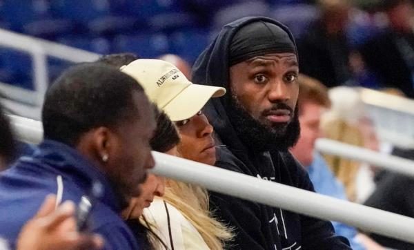 LeBron James and his wife Savannah Brinson watch Bronny James participate in the 2024 NBA Draft Combine.