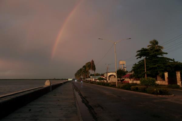 Sunset on the boardwalk in the eastern Cuban city of Manzanillo. Credit: Jorge Luis Baños / IPS