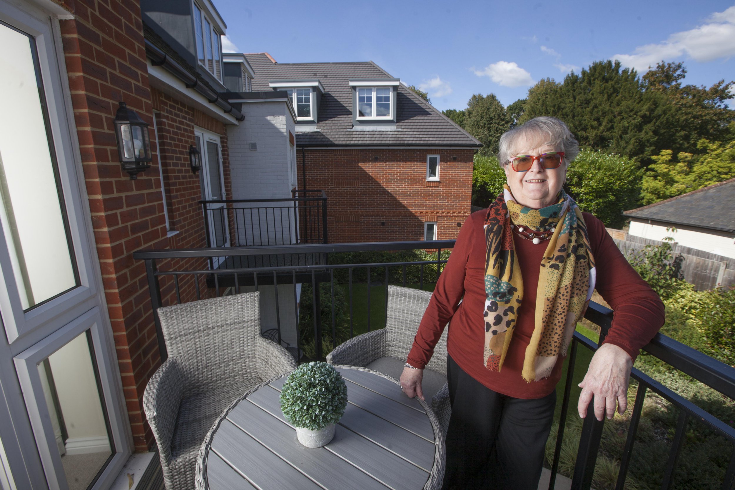 Gill Ross and her apartment in Bagshot, Surrey are the subject of a What I Own feature. This picture shows Gill Ross on her balcony overlooking the private gardens.