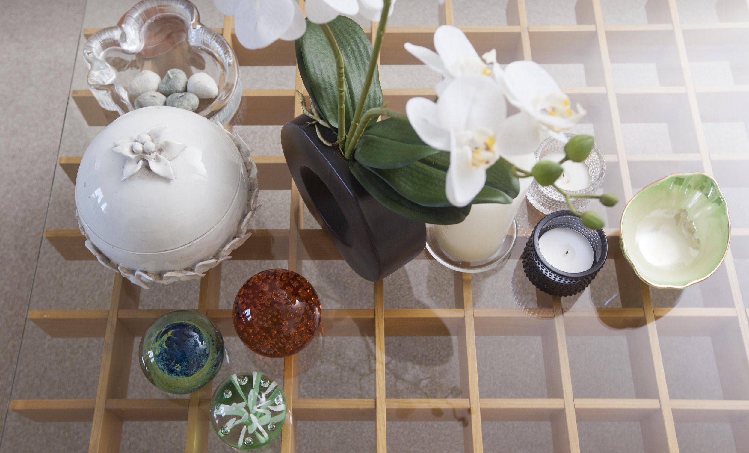 Gill Ross and her apartment in Bagshot, Surrey are the subject of a What I Own feature. This picture shows ornaments on the coffee table in the living room.