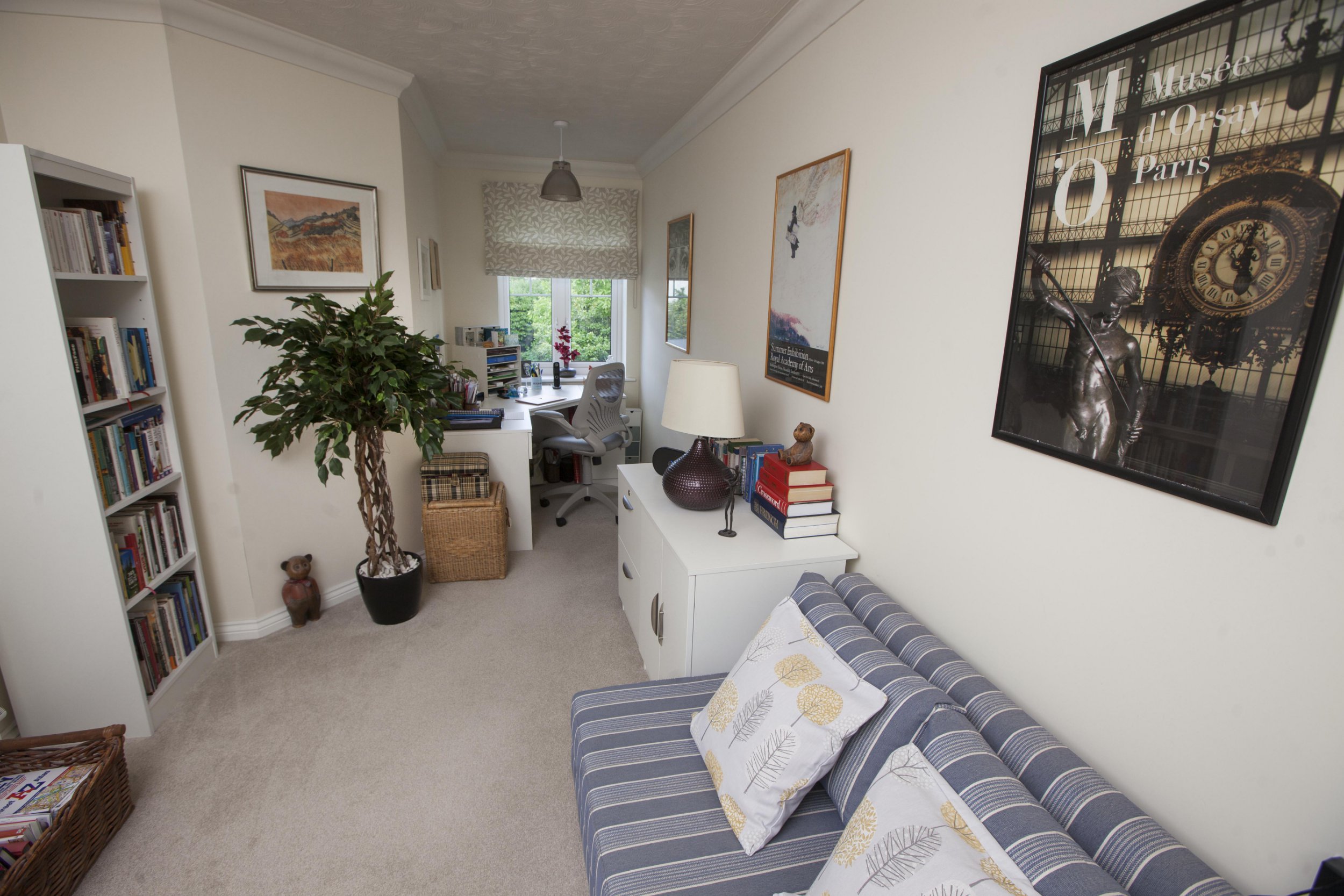 Gill Ross and her apartment in Bagshot, Surrey are the subject of a What I Own feature. This picture shows the second bedroom that has become the office/library.
