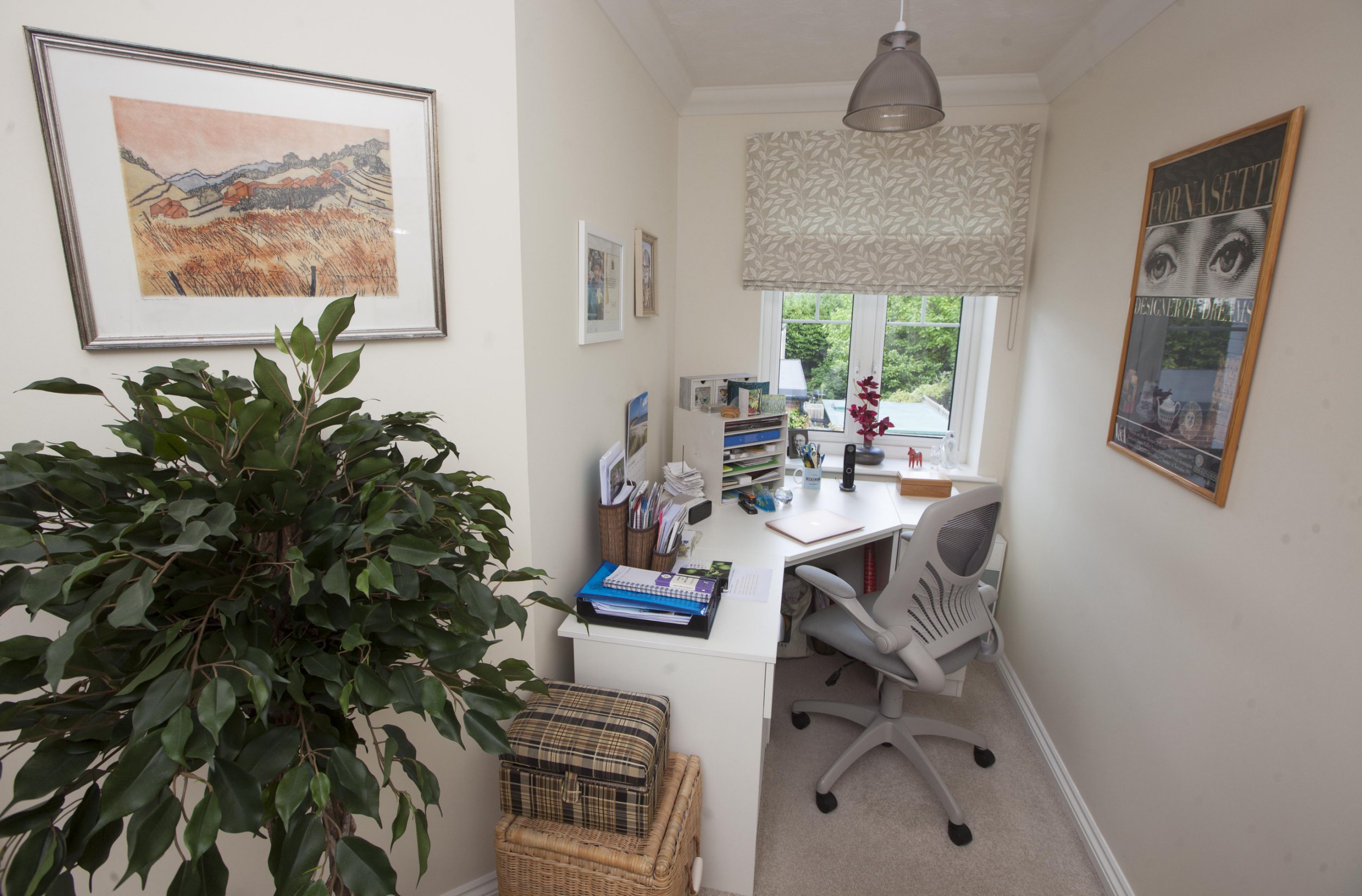 Gill Ross and her apartment in Bagshot, Surrey are the subject of a What I Own feature. This picture shows the second bedroom that has become the office/library.