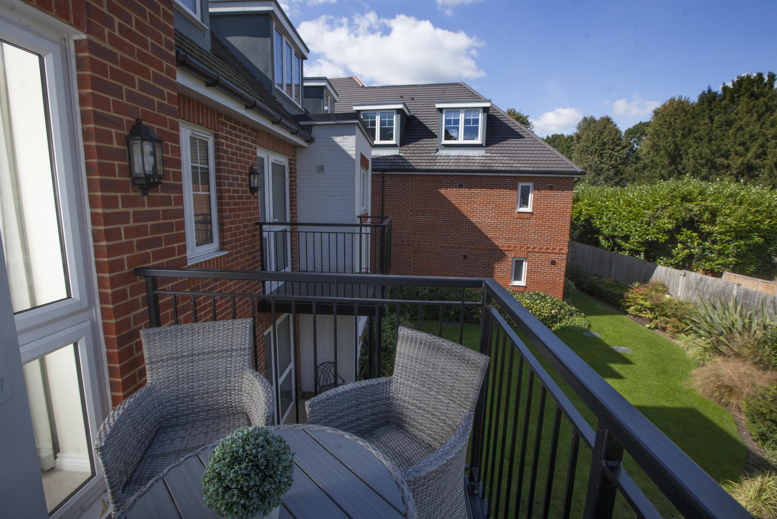 Gill Ross and her apartment in Bagshot, Surrey are the subject of a What I Own feature. This picture shows the balcony overlooking the private gardens.