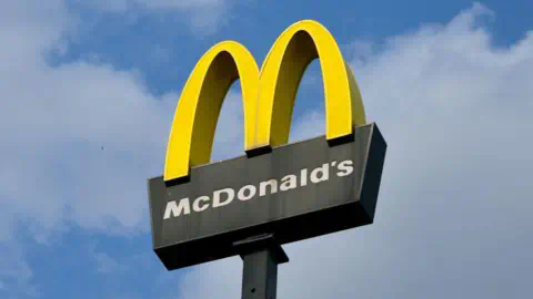 Getty Images McDonald's sign outside of a UK restaurant, featuring golden yellow 'M' logo