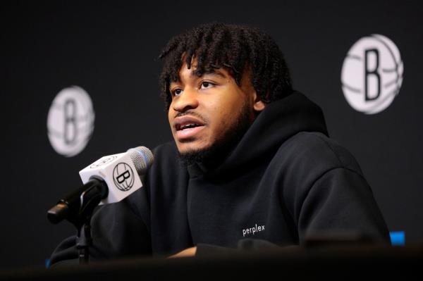 Cam Thomas addresses reporters during an April press conference.