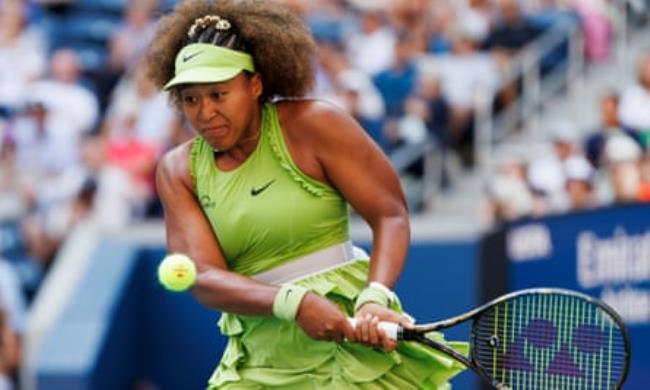 Naomi Osaka returns the ball