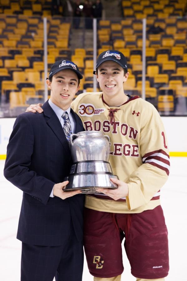 Brothers Johnny Gaudreau #13 and Matthew Gaudreau #21 of the Boston College Eagles celebrate after the Eagles beat the Northeastern University Huskies to win their fifth Beanpot Championship in a row