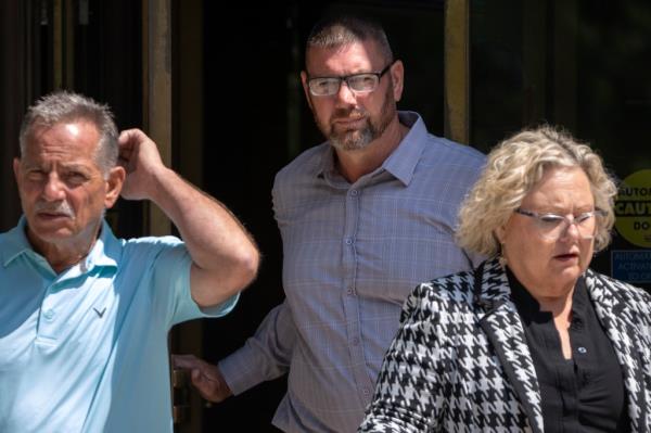 Michael Sparks, center, the first rioter to enter the Capitol on Jan. 6, 2021, leaves federal court on Tuesday, Aug. 27, 2024, in Washington.