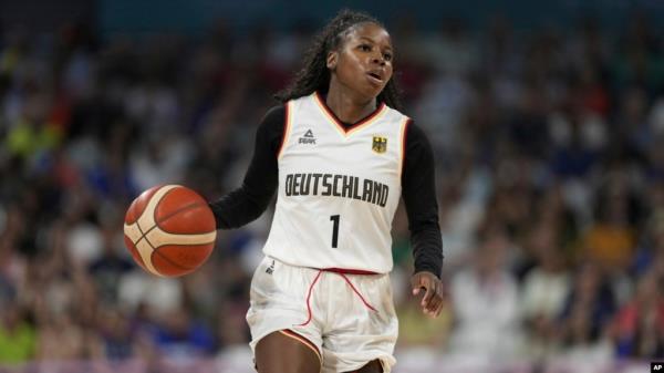 FILE - Alexis Peterson, of Germany, plays against Belgium in a women's basketball game at the 2024 Summer Olympics, in Villeneuve-d'Ascq, France, July 29, 2024.