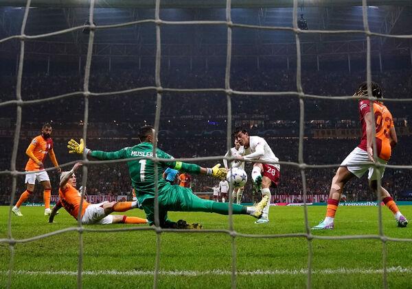 Galatasaray goalkeeper Fernando Muslera saves a shot from Manchester United's Facundo Pellistri. Photo credit: Nick Potts/PA Wire.