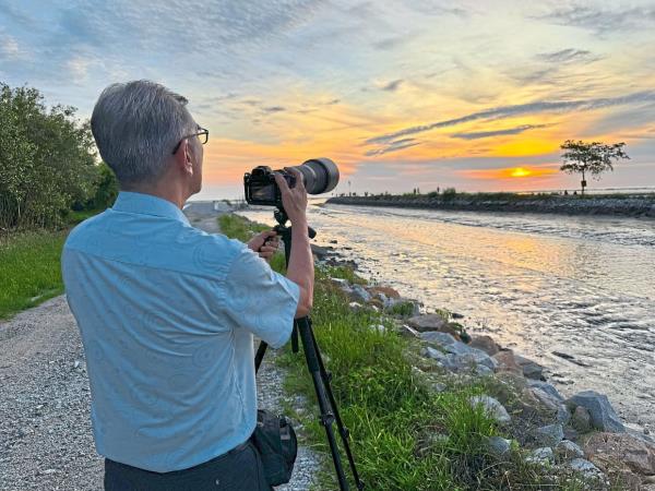 Photographer Yeap Eng Guan waiting for the perfect sunset moment at Pantai Malindo.