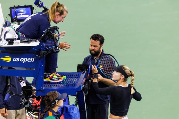 Anna Kalinskaya of Russia discusses a possible doubles bounce with the umpire during her match against Beatriz Haddad Maia on day six of the 2024 U.S. Open tennis tournament.