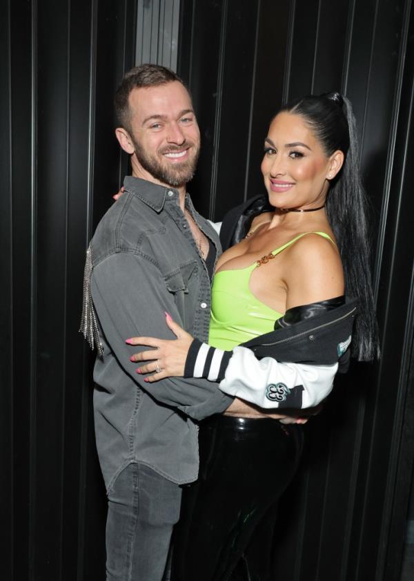 Artem Chigvintsev and Nikki Bella attend Brie and Nikki Bella's live edition of SiriusXM's The Bellas Podcast on February 08, 2023 in Phoenix, Arizona. 