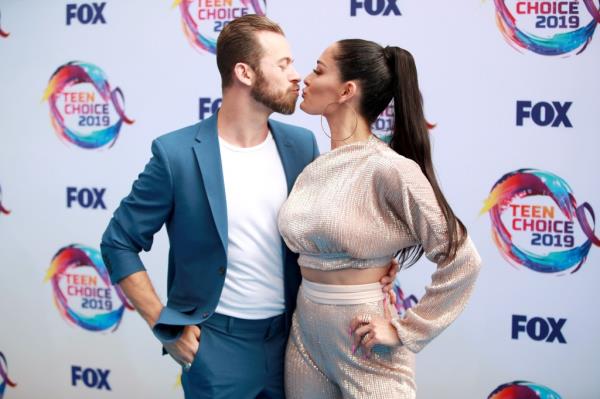 Artem Chigvintsev and Nikki Bella attend FOX's Teen Choice Awards 2019 on August 11, 2019 in Hermosa Beach, California.