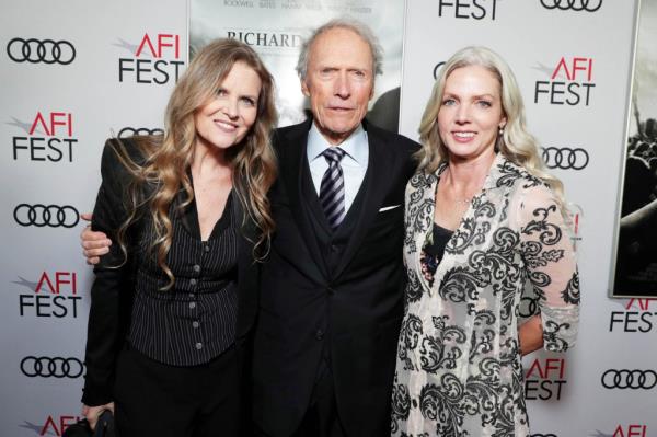 Clint Eastwood poses with girlfriend Christina Sandera on the red carpet at AFI Fest in 2019.