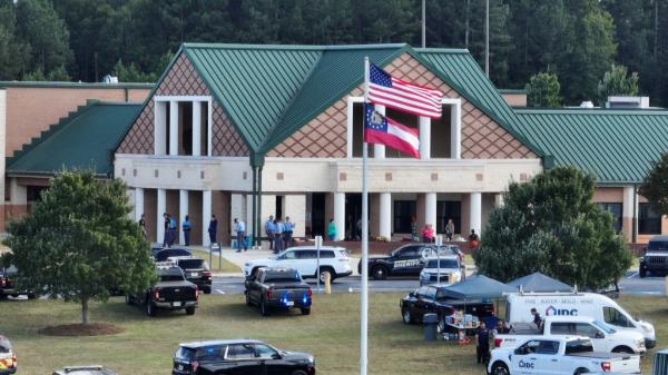 Police officers respond to a deadly school shooting at Apalachee High School in Winder, Georgia,