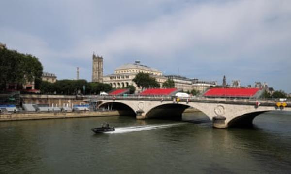 French maritime police patrol the Seine in Paris on Thursday, ahead of the opening of the 2024 Olympic Games.