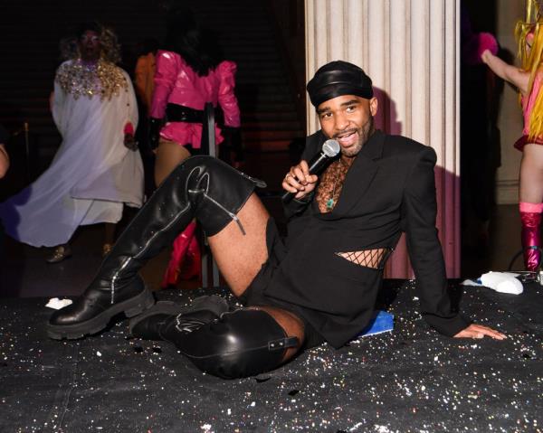 Artist Jacolby Satterwhite sitting on the floor