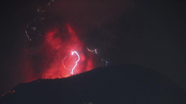 Indonesia’s Mount Ibu erupts three times, spewing lava and clouds of grey ash