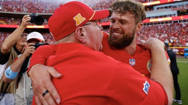 Kansas City Chiefs coach Andy Reid embraces the ever-reliable Harrison Butker after his match-winning contribution against the Cincinnati Bengals