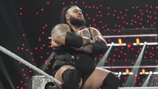WWE superstar Bronson Reed poses on the top rope after attacking Seth Rollins on Monday Night Raw