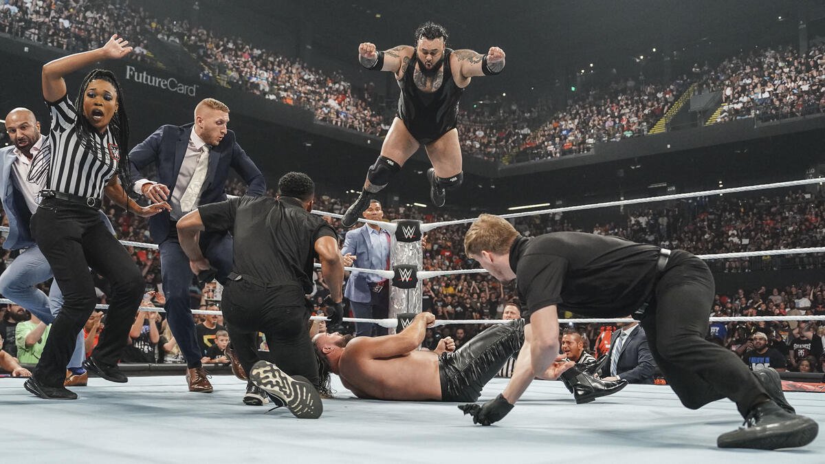 Bronson Reed hits Seth Rollins with a sixth Tsunami as officials try to stop him on WWE Raw