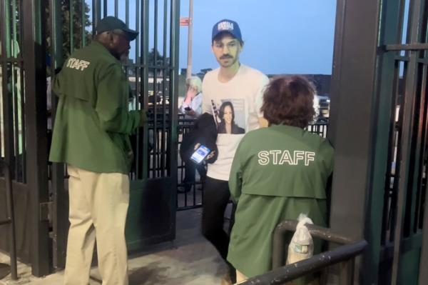 A New York Post reporter wearing Kamala Harris gear entering Citi Field