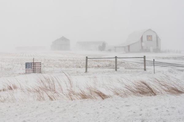 Jose Galeno shovels snow in Omaha, Neb
