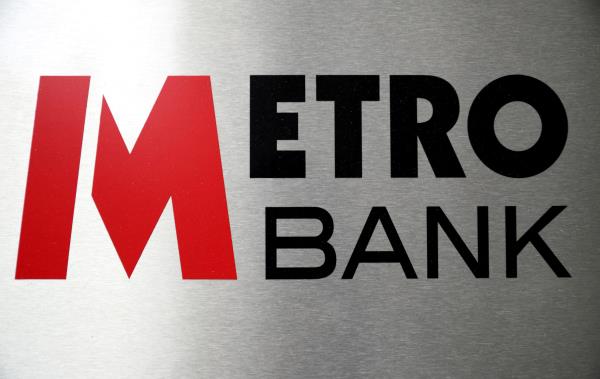 Signage is seen outside of a Metro Bank in London