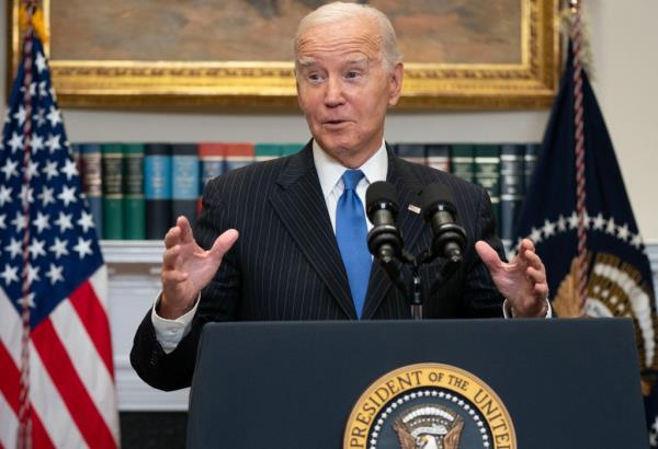 United States President Joe Biden arrives to deliver remarks.
