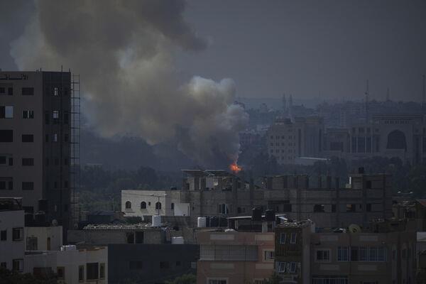 Fire and smoke rise following an Israeli airstrike in Gaza City on Wednesday. Picture: AP /Hatem Moussa Fire and smoke rise following an Israeli airstrike in Gaza City on Wednesday. Picture: AP /Hatem Moussa