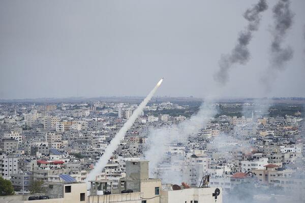 Rockets are launched by Palestinian militants from the Gaza Strip towards Israel on Saturday. Picture: AP Photo/Hatem Moussa Rockets are launched by Palestinian militants from the Gaza Strip towards Israel on Saturday. Picture: AP Photo/Hatem Moussa