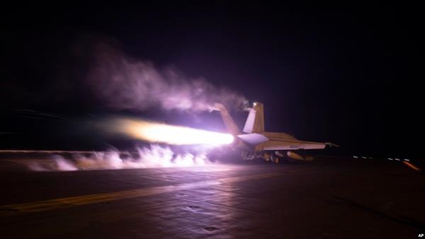 FILE - This image provided by the U.S. Navy shows an aircraft launching from the USS Dwight D. Eisenhower during Red Sea flight operations, Jan. 22, 2024. U.S. and British militaries have been bombing multiple targets of Iran-backed Houthis in Yemen.