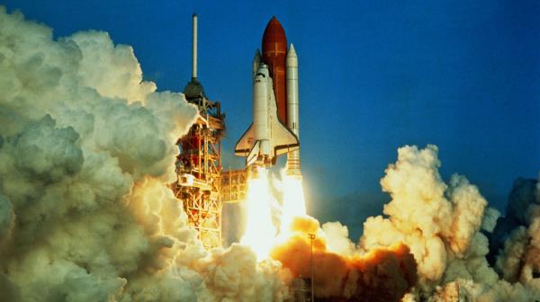 Space shuttle lifting off