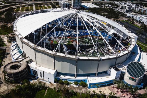 Hurricane Milton making landfall in Tampa, Florida, causing extensive damage to the Kevlar roof of Tropicana Field, home of the Tampa Bay Rays baseball team.