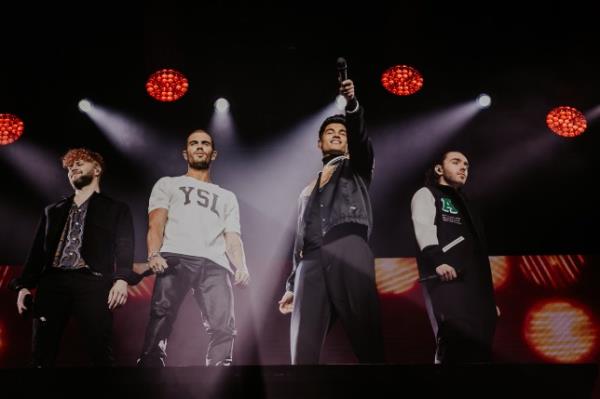 The Wanted members Jay McGuiness, Max George, Siva Kaneswaran and Nathan Sykes perform onstage