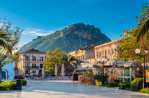 Philellinon square in Nafplio-The historic square of the city located in the old town.The castle of Palamidi in the background.