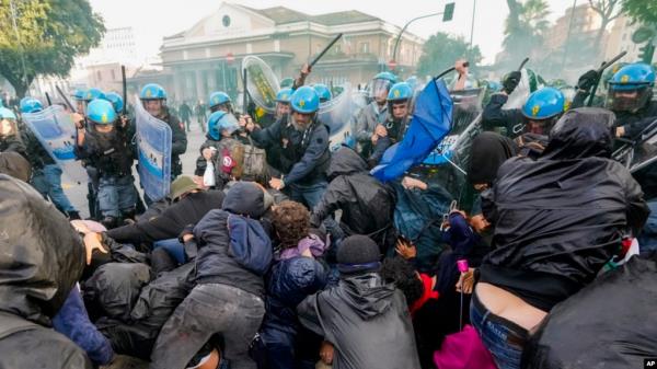 Italian police and demonstrators clash during a march in support of the Palestinian people in Rome, Oct. 5, 2024.