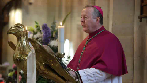 PA Media Archbishop Eamon Martin standing on the alter of a church.